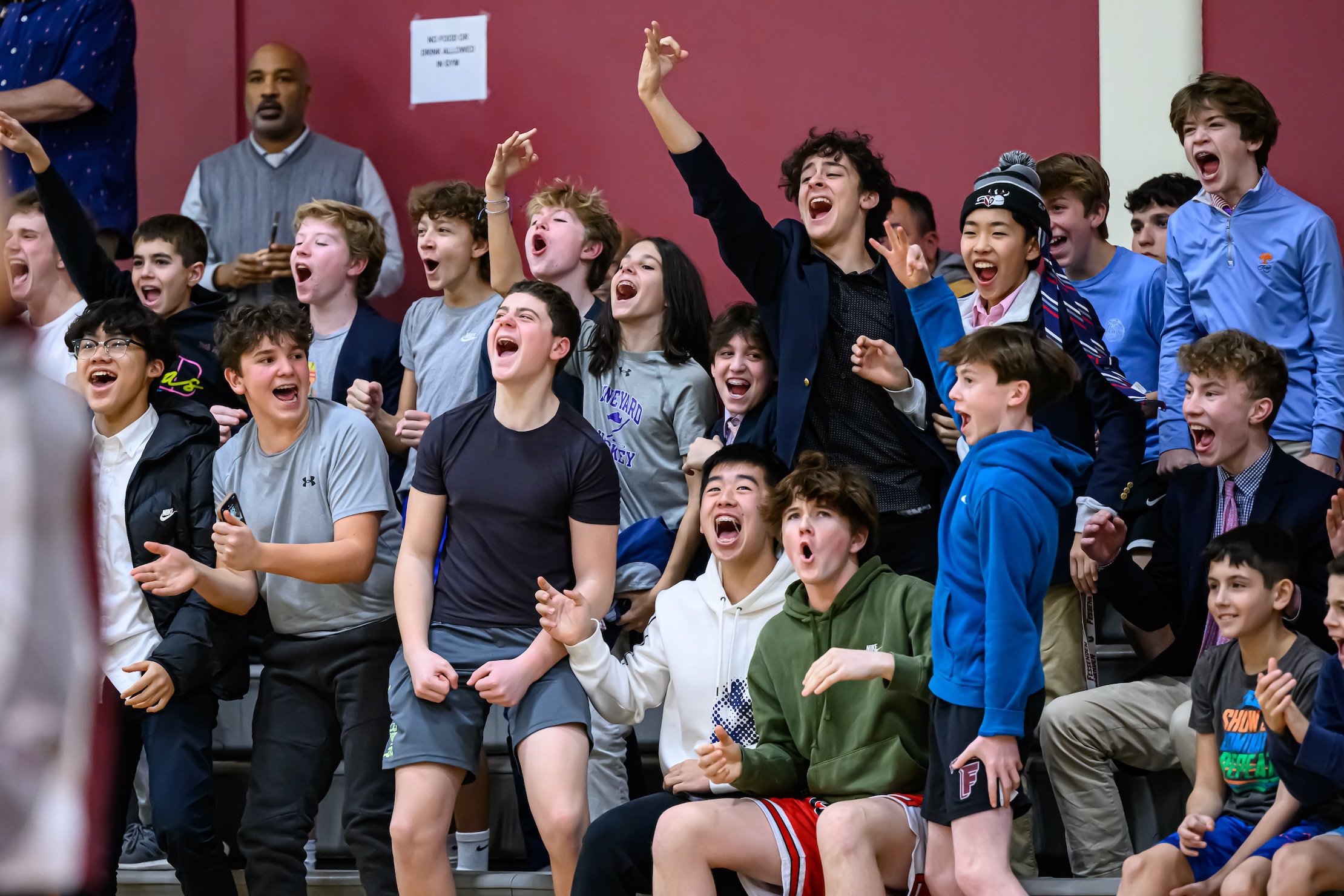 Fessenden students celebrating a three point shot being made in the student section