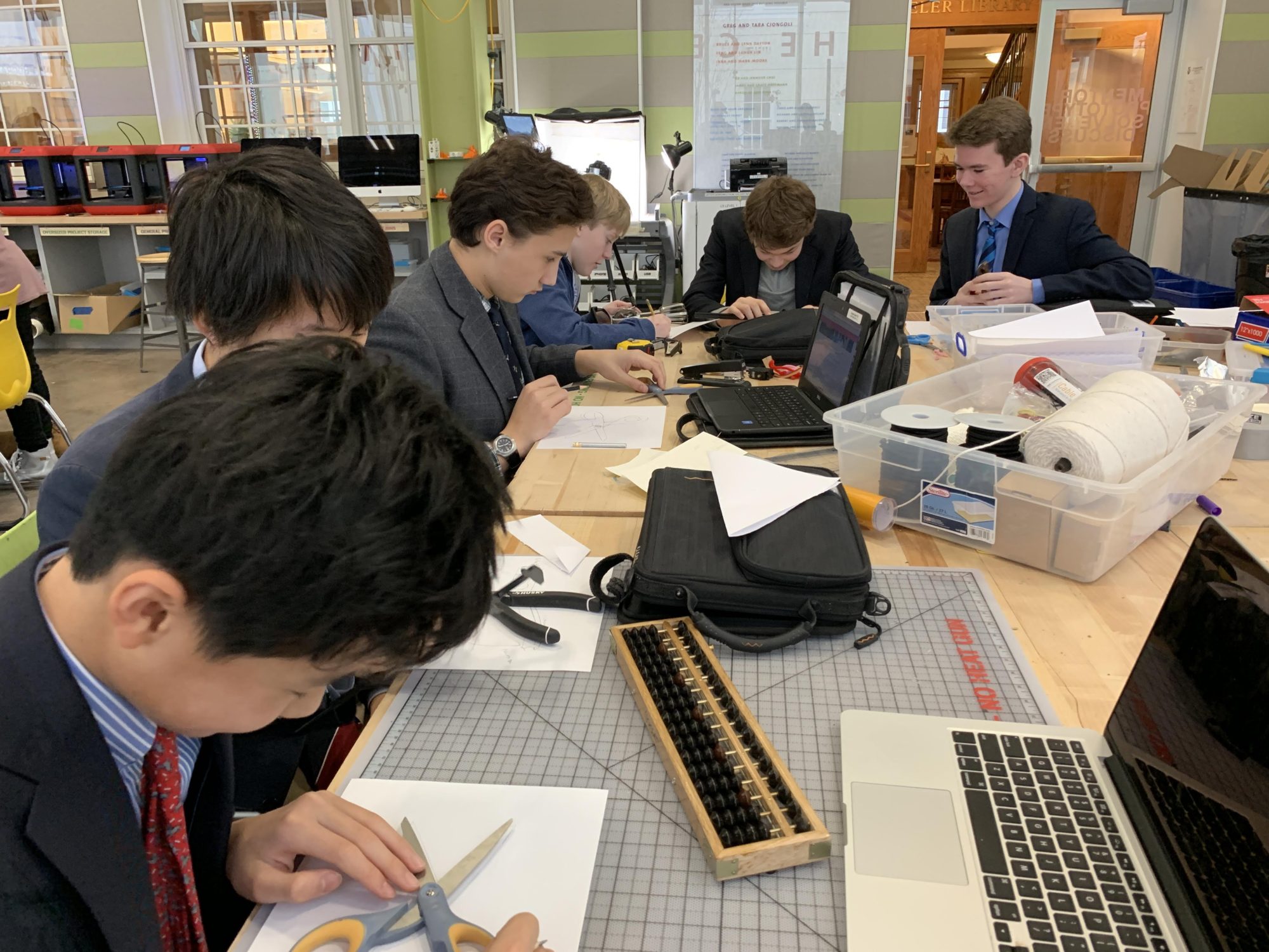 Middle school students at The Fessenden School working on a project together during class.