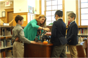 Students interacting with their teacher