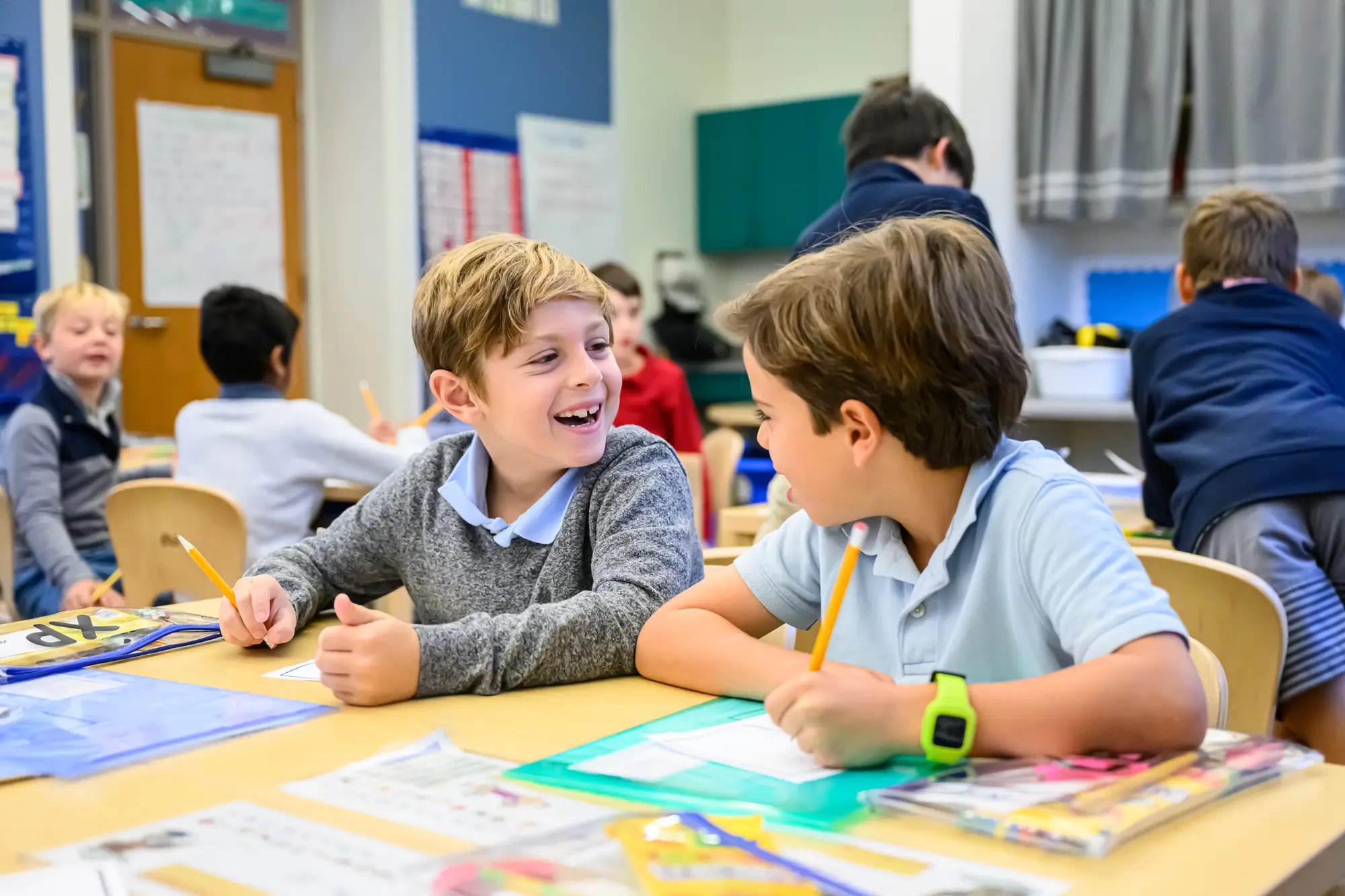 Two kindergarten boys talk during class