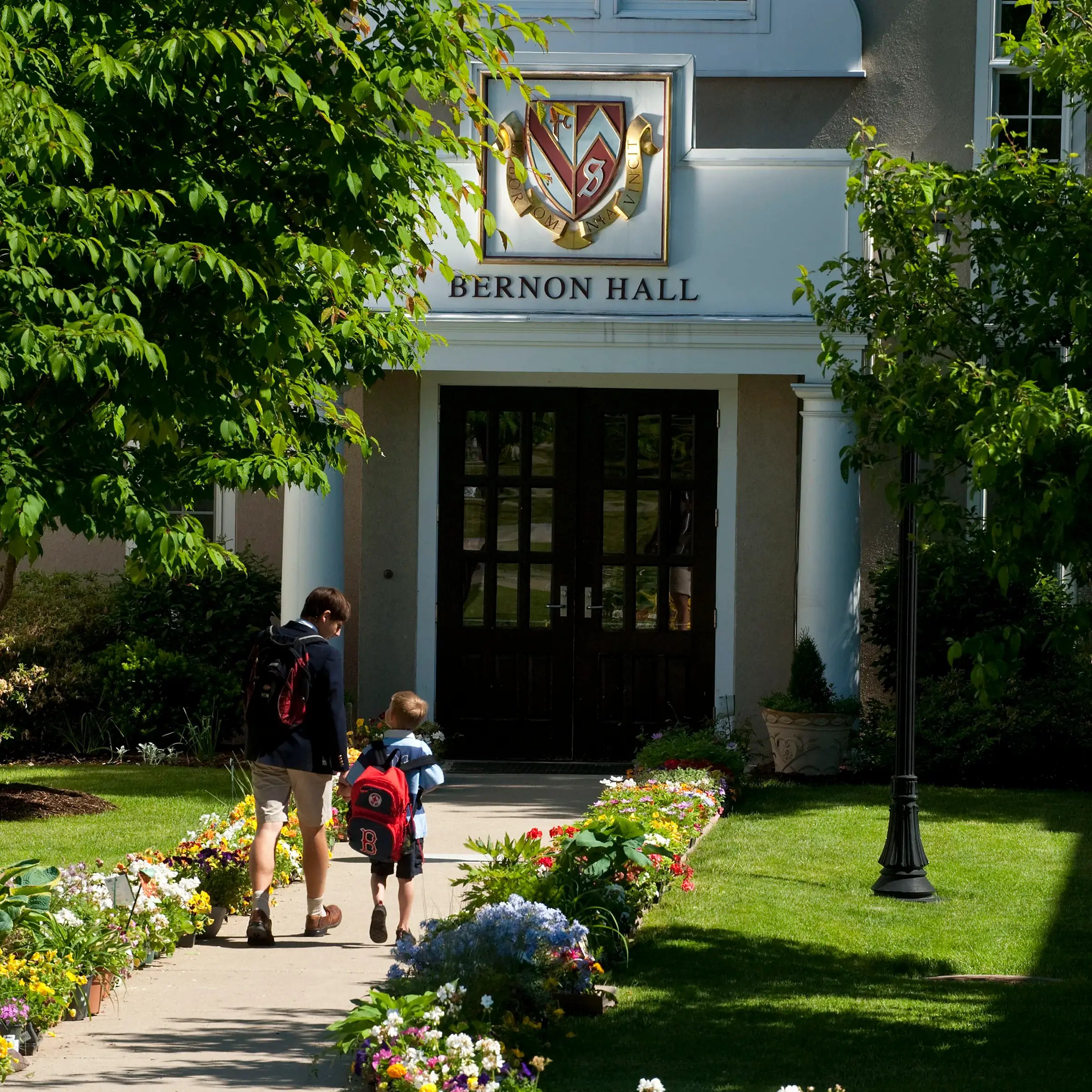 Boys walking into Bernon Hall