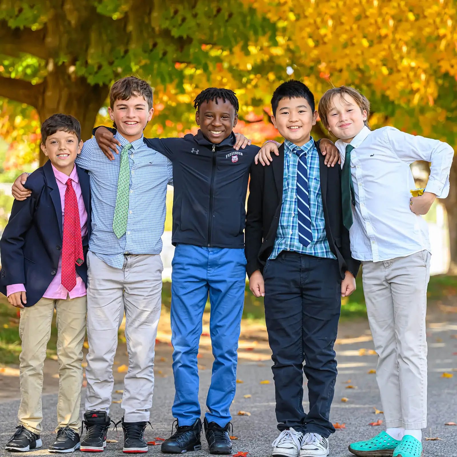 Group of boys with arms around each other