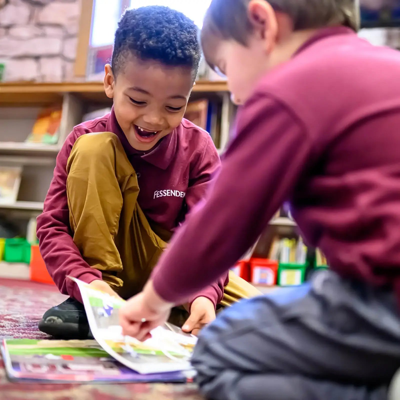 Tow young boys reading together