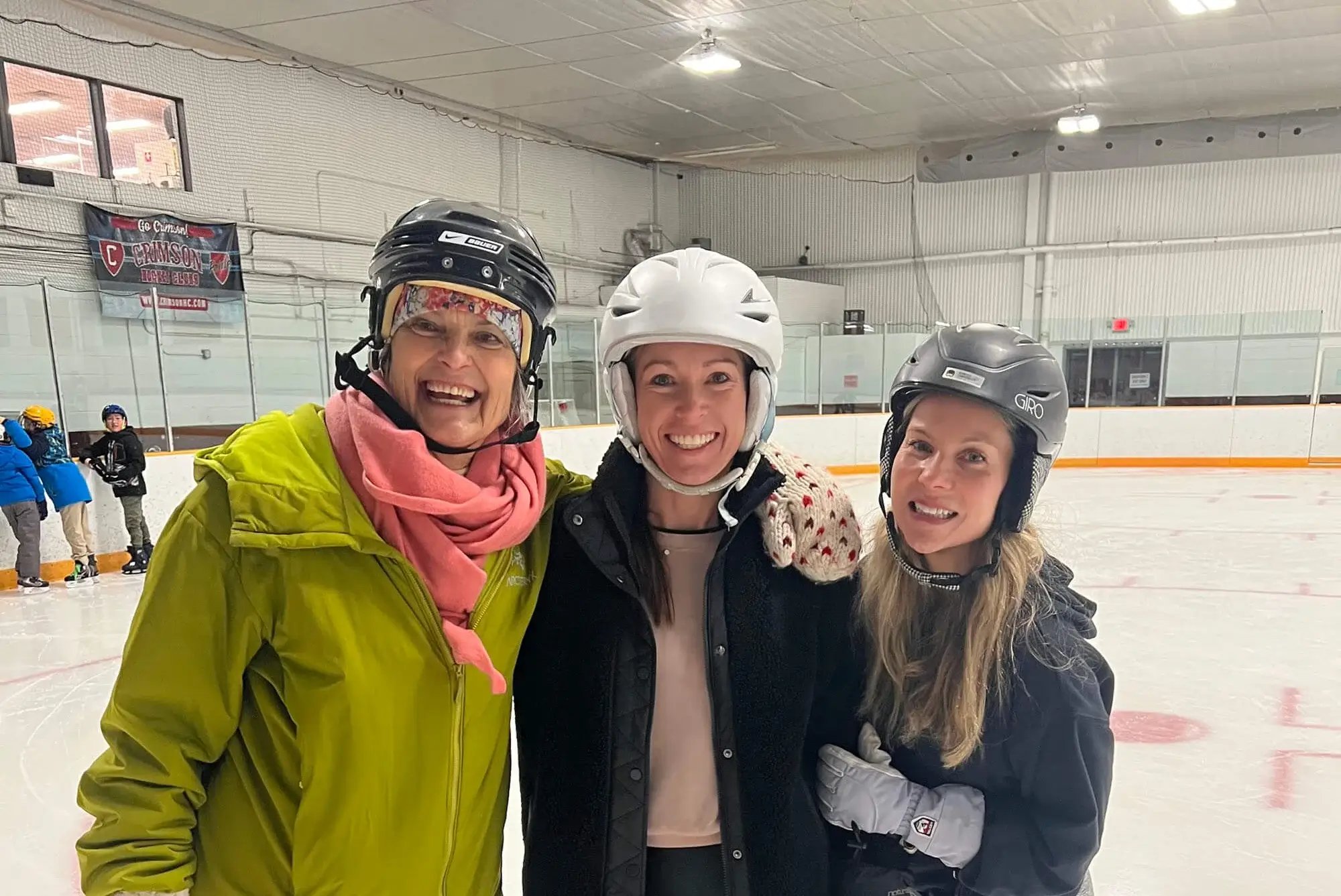 Lower school skating party - three women on ice skates