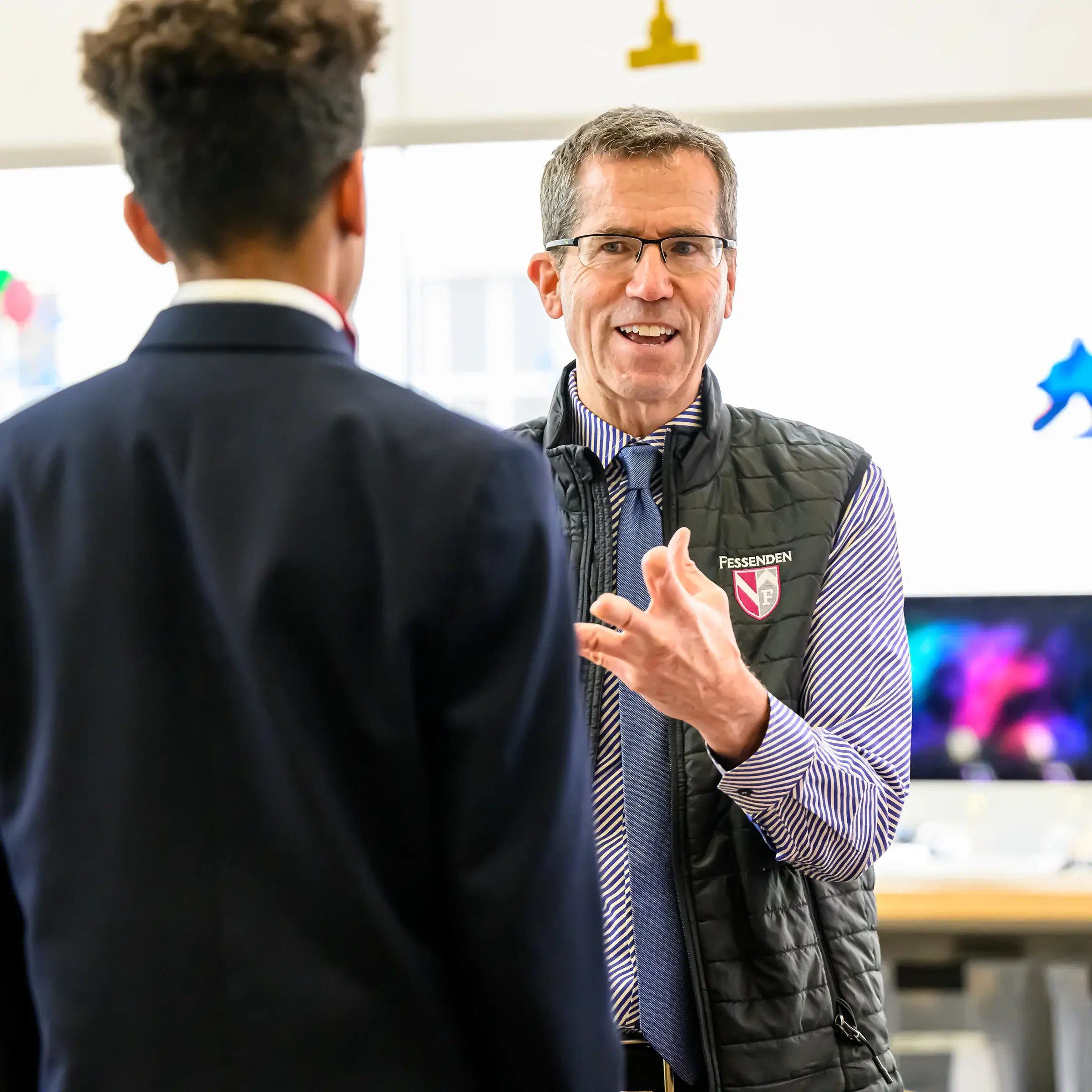A teacher talking to a student