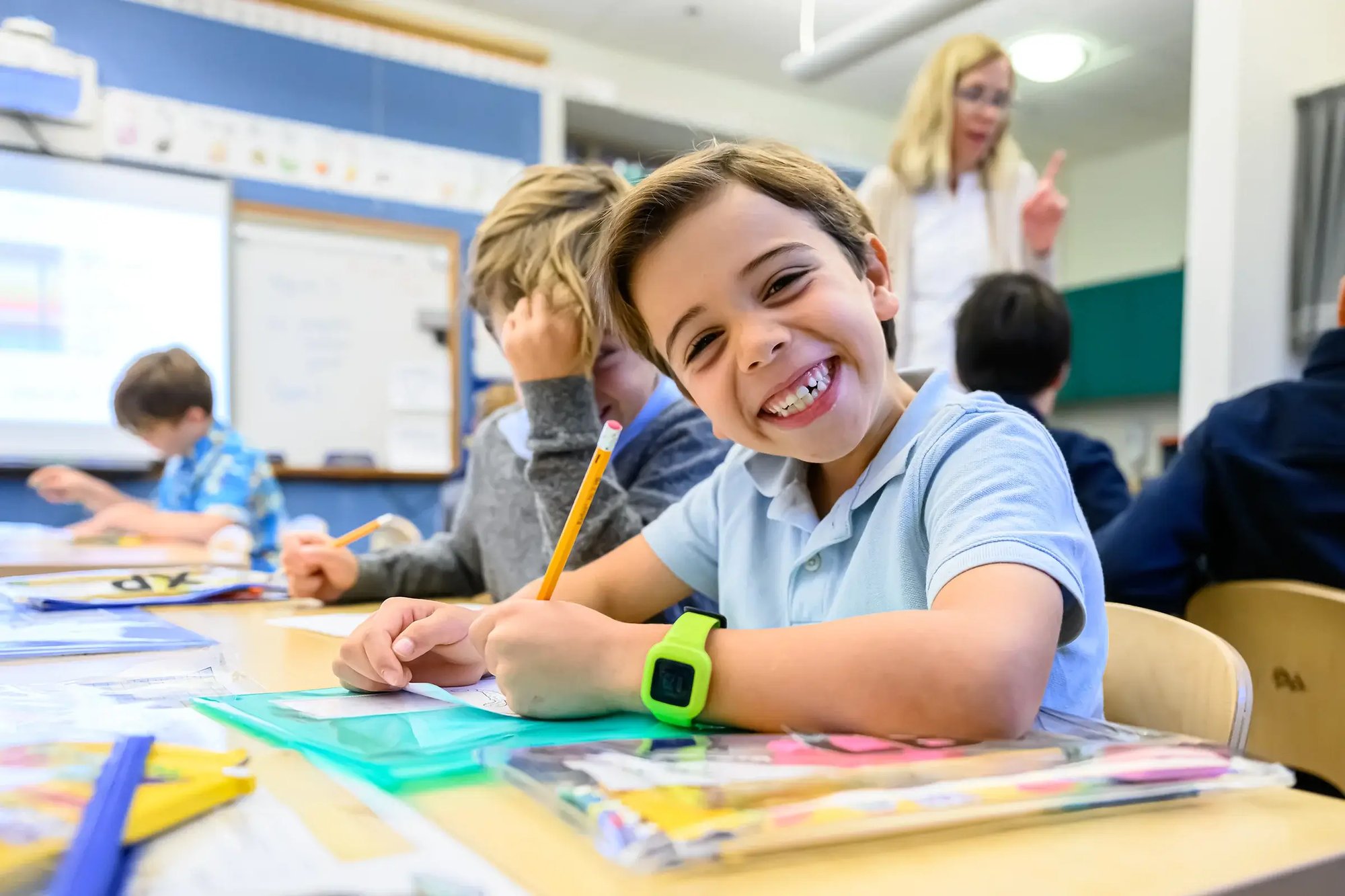 Young boy smiling in class