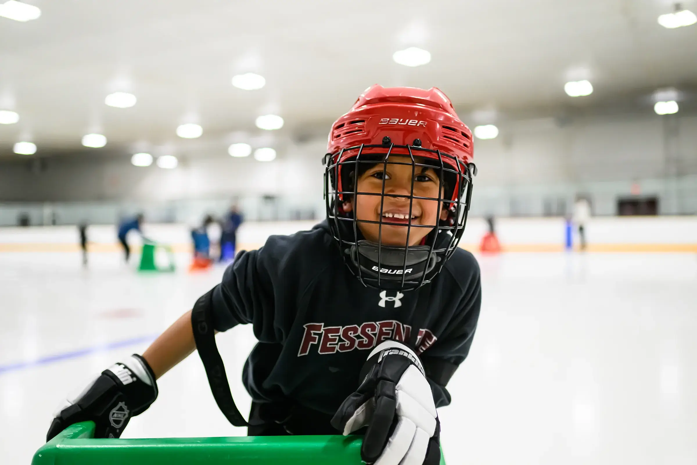 Boy in hockey mask smiling