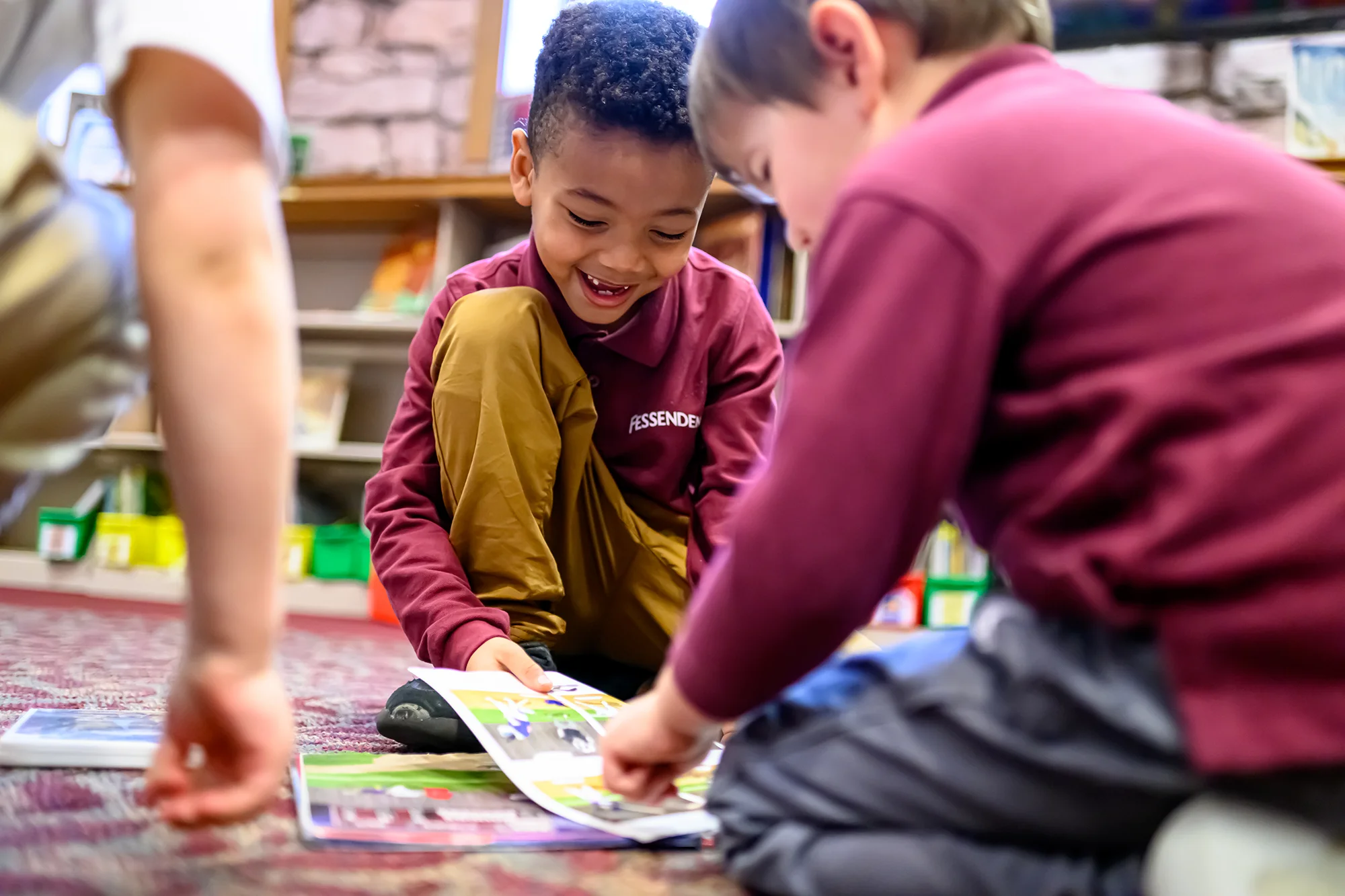 Boys reading together in Wheeler Library